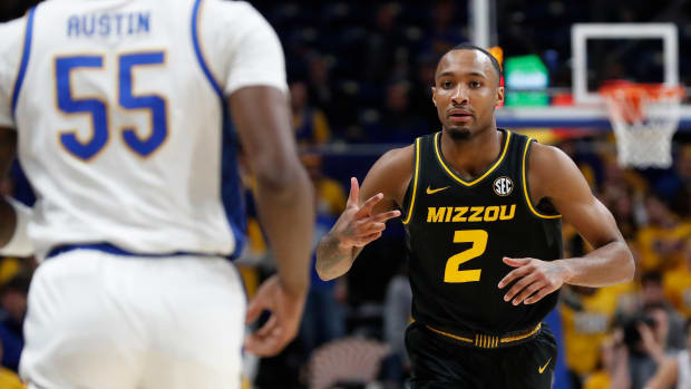 Nov 28, 2023; Pittsburgh, Pennsylvania, USA; Missouri Tigers guard Tamar Bates (2) reacts to Pittsburgh Panthers forward Zack Austin (55) after Bates made a three point basket during the first half at the Petersen Events Center